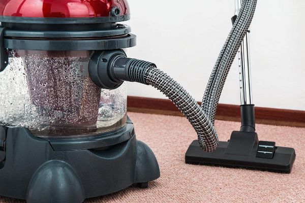 Professional cleaners at Canadian Carpet Cleaning fixing water damage after flooding
