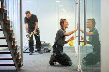 Professional team of commercial and janitorial cleaners cleaning an office
