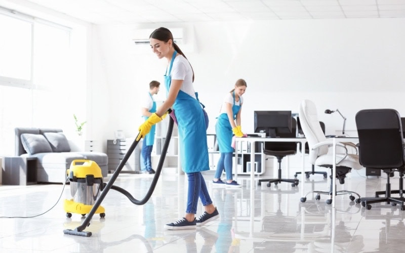 Canadian Carpet Cleaning team cleaning an office space.